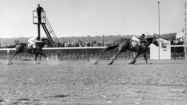 Whirlaway (here with horse Robert Morris) won the Triple Crown in 1941 and was named Horse of the Year.