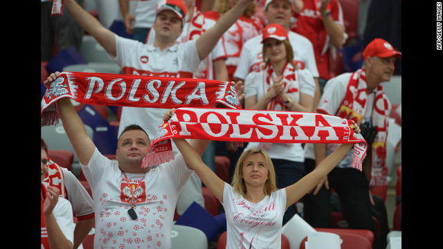 Polish fans hold up banners before the Euro 2012 match between Poland and Greece.