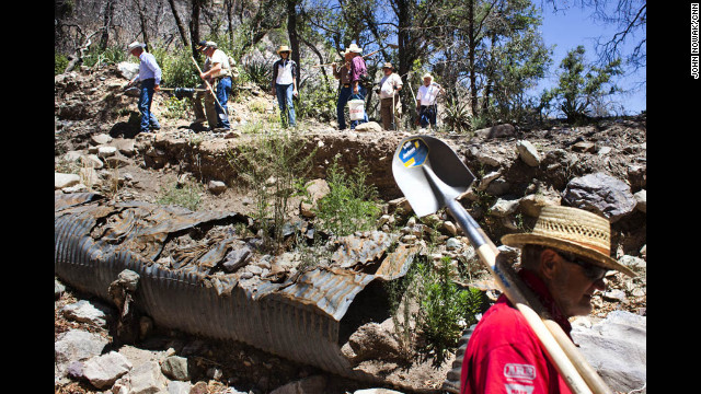 Volunteers make their way through the Coronado National Forest to Gardner Spring, one of the sources of water for the city of Tombstone.
