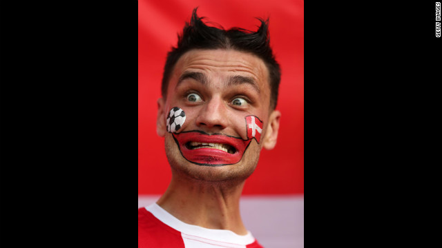 A Danish fan mugs before the match between the Netherlands and Denmark.