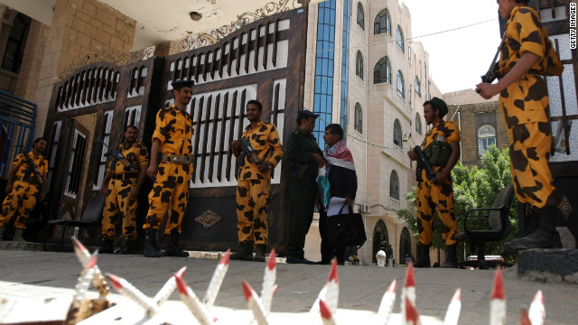 Yemeni troops guard a government building in the capital, Sanaa, last month following reported Al-Qaeda threats.