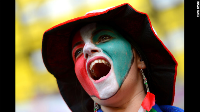 An Italy fan cheers before Sunday's match against Spain.