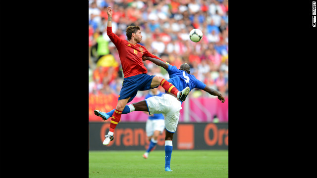 Sergio Ramos of Spain and Mario Balotelli of Italy compete for the ball duing their match in Gdansk, Poland, Sunday, June 10.