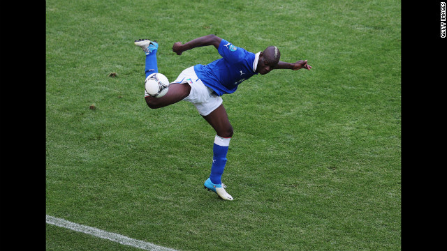 Italy's Mario Balotelli takes control of the ball in Sunday's match against Spain. 