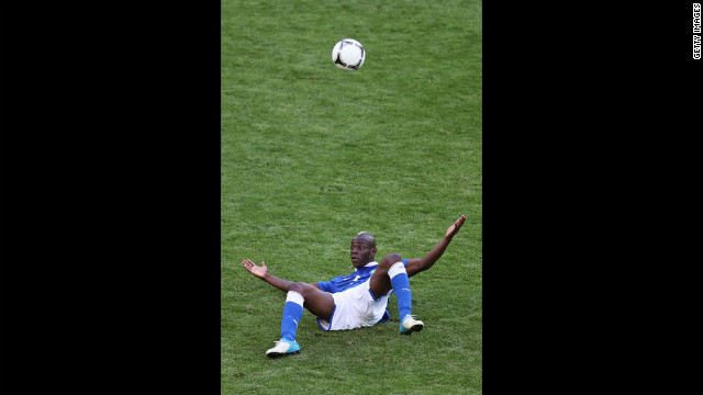 Italy's Mario Balotelli looks up after a fall during the Spain-Italy match.
