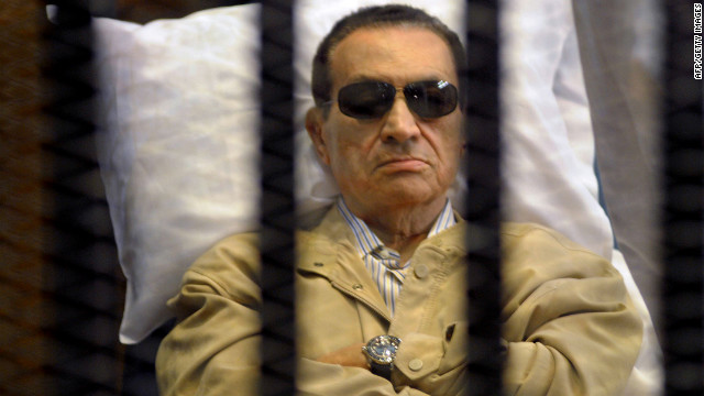 The ousted leader lies in a medical bed inside a cage in a courtroom during his verdict hearing in Cairo on June 2, 2012. A judge sentenced Mubarak to life in prison for his role in ordering the killing of protesters in the 2011 uprisings.