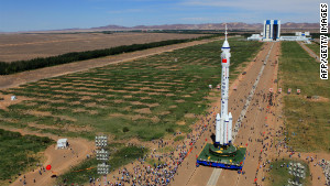 The Shenzhou-9 spacecraft and its carrier rocket as seen Saturday in northwest China\'s Gansu province.