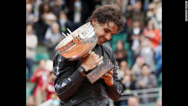 Rafael Nadal of Spain celebrates after beating Novak Djokovic of Serbia to win his seventh French Open title in Paris on Monday, June 11.