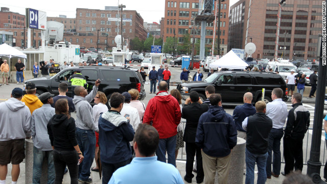 Spectators and press crowd in front of the John Joseph Moakley courthouse in Boston as Bulger and Greig arrive for arraignment on June 24, 2011.