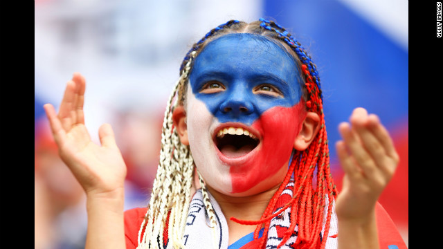A fan cheers during the Greece-Czech Republic match Tuesday at the Municipal Stadium in Wroclaw.