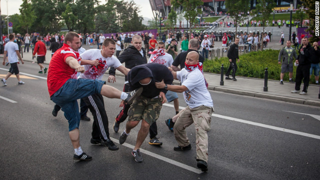 Polish and Russian football fans clash in Warsaw, Poland, on Tuesday ahead of the match between Poland and Russia at the Euro 2012 championships.