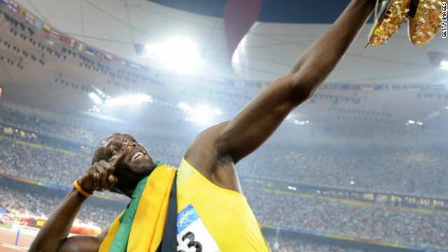 Usain Bolt strikes his trademark pose after claiming gold in the 100 meters at the 2008 Beijing Olympics.