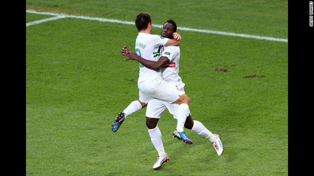 Silvestre Varela of Portugal celebrates scoring their third goal against Denmark with Joao Moutinho of Portugal.