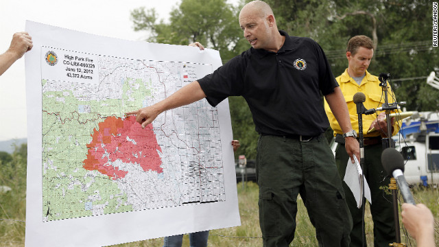 Steve Segin of the U.S. Forest Service shows a map of the size and location