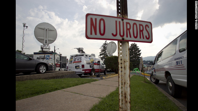 Live vans from regional news outlets fill the lot behind the Centre County Courthouse where the Sandusky trial is taking place. 