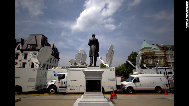 Several news vans pile up outside of the Sandusky trial. The network satellite vans are all parked in front of the Centre County Courthouse and the vans parked in back are live trucks from the regional news outlets. 