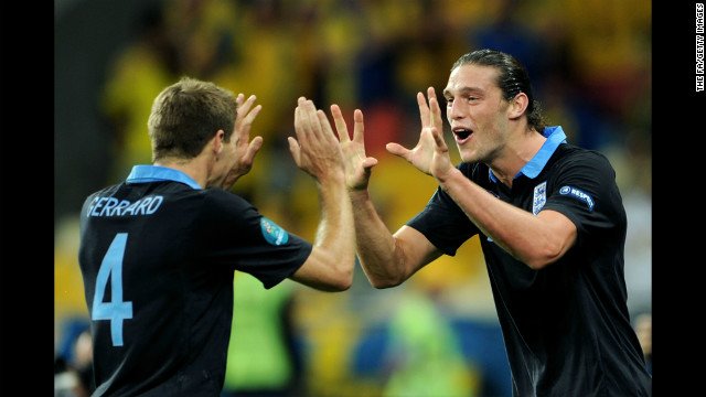 Andy Carroll, right, of England celebrates the first goal with captain Steven Gerrard during the match between Sweden and England.