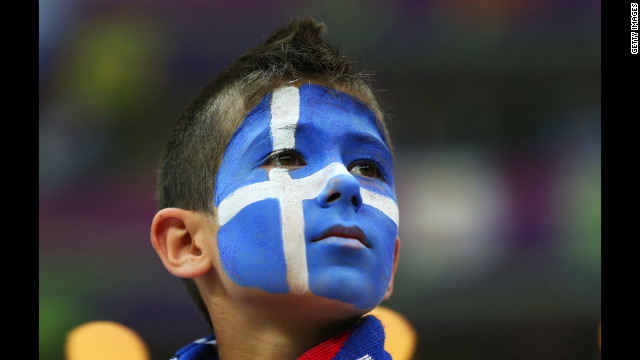 A Greece fan enjoys the atmosphere ahead of the match between Greece and Russia.