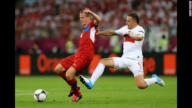 David Limbersky of Czech Republic is tackled by Dariusz Dudka of Poland during the match between Czech Republic and Poland.