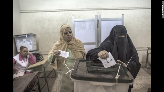 Egyptian women cast their votes at a polling station.