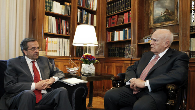 Greek President Karolos Papoulias, right, meets New Democracy leader Antonis Samaras before he receives a mandate to form a government on June 18 in Athens. 