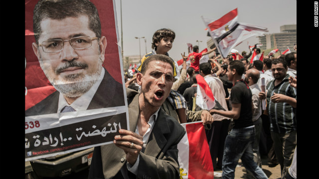 Morsi supporters rally in Cairo's Tahrir Square on Monday, June 18. Morsi declared victory as Egypt's first democratically elected president even as military rulers issued a decree that virtually stripped the position of power.