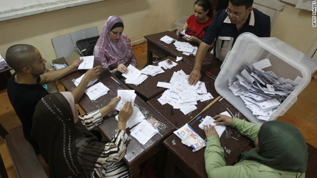 Egyptian election officials count ballots at a polling station in Cairo on Sunday, June 17. The official vote count was scheduled to be finished Monday.