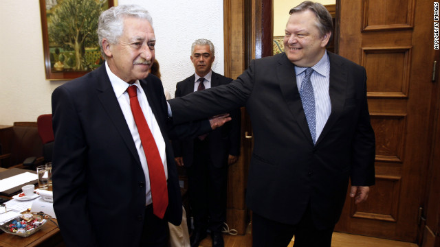 Venizelos, right, shakes hands with the leader of the Democratic Party of the Left, Fotis Kouvelis, at the Greek parliament on June 19, 2012. Venizelos said discussions would continue Wednesday into the exact makeup of the new government. 