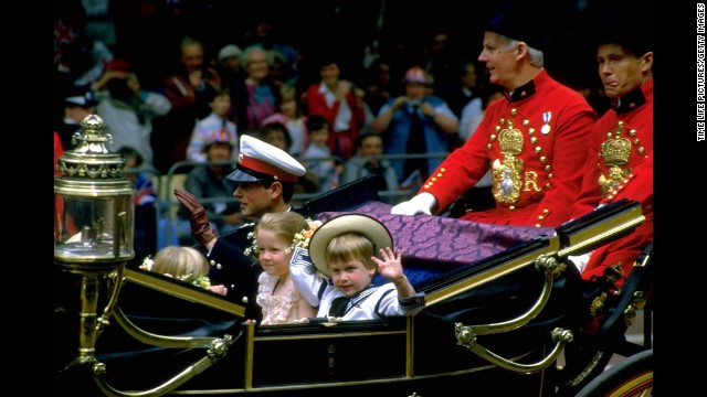 Prince William waves from a carriage en route to the wedding of Prince Andrew and Sarah Ferguson on July 23, 1986.