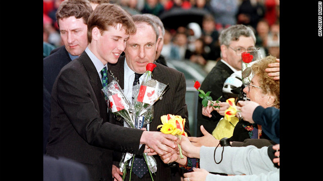 Prince William receives flowers from an adoring crowd in Vancouver on March 24, 1998. He was on a weeklong vacation with his father and brother, though they also made time for official engagements.