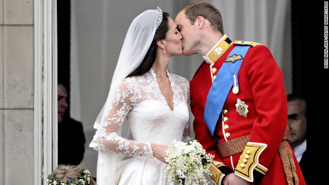 After their wedding service, Prince William kisses his wife, Kate Middleton, on the balcony of Buckingham Palace on April 29, 2011.