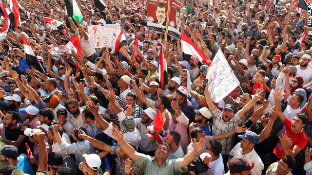 Muslim Brotherhood supporters cheer in Cairo's Tahrir Square on Sunday, June 24, after hearing of Mohammed Morsi's victory in Egypt's presidential election.