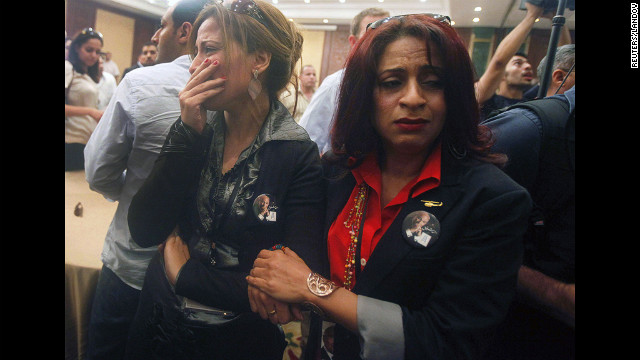 Supporters of presidential candidate Ahmed Shafik react after hearing the results of the presidential elections in Cairo on June 24. 
