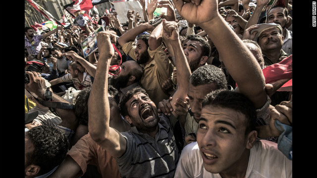 Egyptians celebrate the election of Morsi after he won 51% of the vote to defeat Shafik.