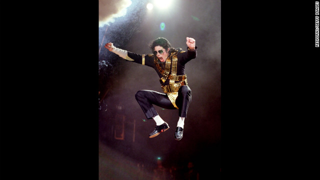 Known for his dance moves, Jackson is seen here jumping in the air while performing during the Dangerous tour in 1992.
