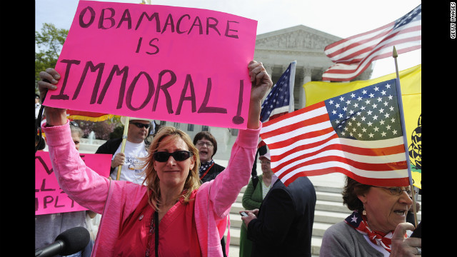 Opponents of Obama's health care legislation protest in front of the Supreme Court on March 28. Critics argued the law's requirement that most Americans have health insurance or pay a fine was an unconstitutional intrusion on individual freedom.