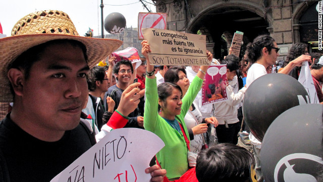 Youth demonstrators march in Mexico City, protesting presidential candidate Enrique Pena Nieto.