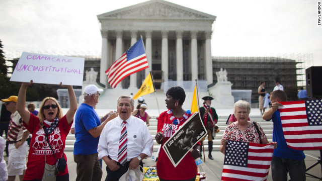 Protesters against the health care law rally outside the Supreme Court before the justices issue their ruling Thursday.