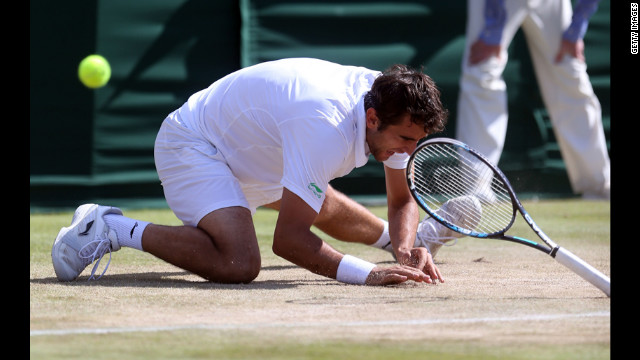 Marin Cilic of Croatia falls to the ground Saturday during play in his match against Sam Querrey of the United States.