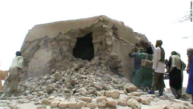 Islamist militants destroying the ancient shrine of a Muslim saint in Timbuktu, Mali, on July 1, 2012.