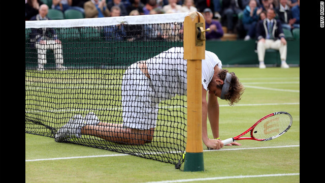 Fish falls to the ground during his fourth round match against Tsonga.