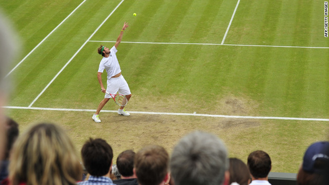 Mardy Fish of the United States serves to France's Jo-Wilfried Tsonga on Tuesday.