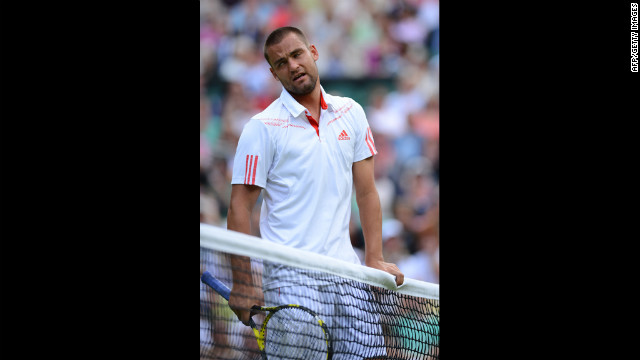Russia's Mikhail Youzhny reacts during his men's singles quarterfinal match against Switzerland's Roger Federer on Wednesday.