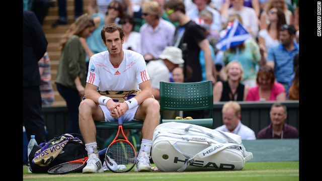 Murray ponders between games during his men's singles quarter-final match against Ferrer.