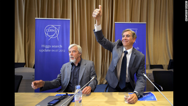 Joe Incandela, right, spokesman for the Compact Muon Solenoid experiment, gestures to the crowd next to Rolf Heuer, director-general of the European Organization for Nuclear Research, CERN, at a press conference announcing the major breakthrough in July 2012 in Meyrin, Switzerland.