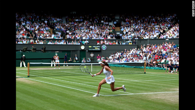 Radwanska returns a shot during her Ladies' Singles semifinal match against Kerber.