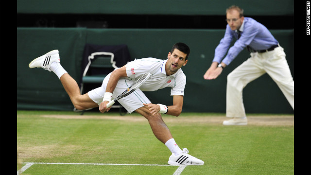 Novak Djokovic reacts during his men's singles semifinal match Friday against Roger Federer.