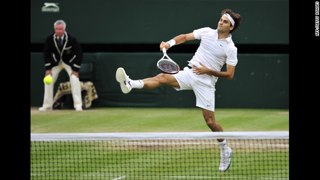Roger Federer plays a shot during his men's singles semifinal match against Novak Djokovic.