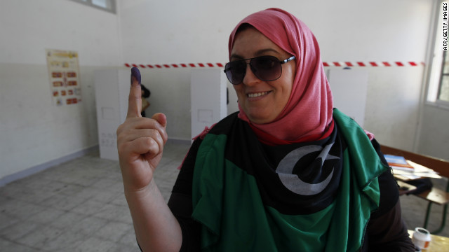 A Libyan woman shows her inked finger after casting her ballot at a polling station in Benghazi during Libya's General National Assembly election on Saturday.