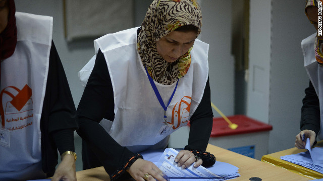 Libyan election workers start the ballot-counting process at a Tripoli polling station during Libya's General National Assembly.